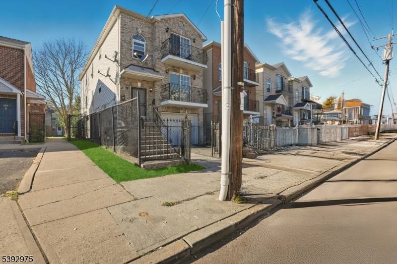 Welcome to 537 S 18th Street, a spacious and beautifully renovated three story two family home in Newark.