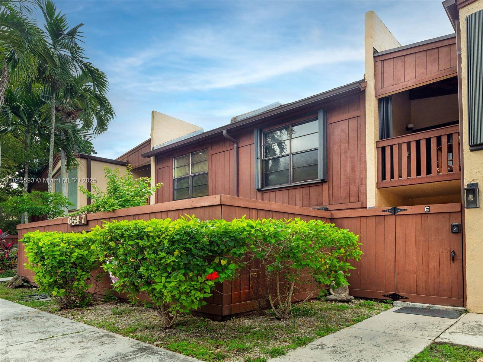 Located in the gated community of Snapper Village, this updated 3 bedroom, 2 bath residence offers a functional layout and 2 large patios, one with direct greenbelt access.