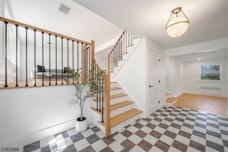 Welcome to this stunning, split level home nestled in one of Mountainside's most desirable neighborhoods !