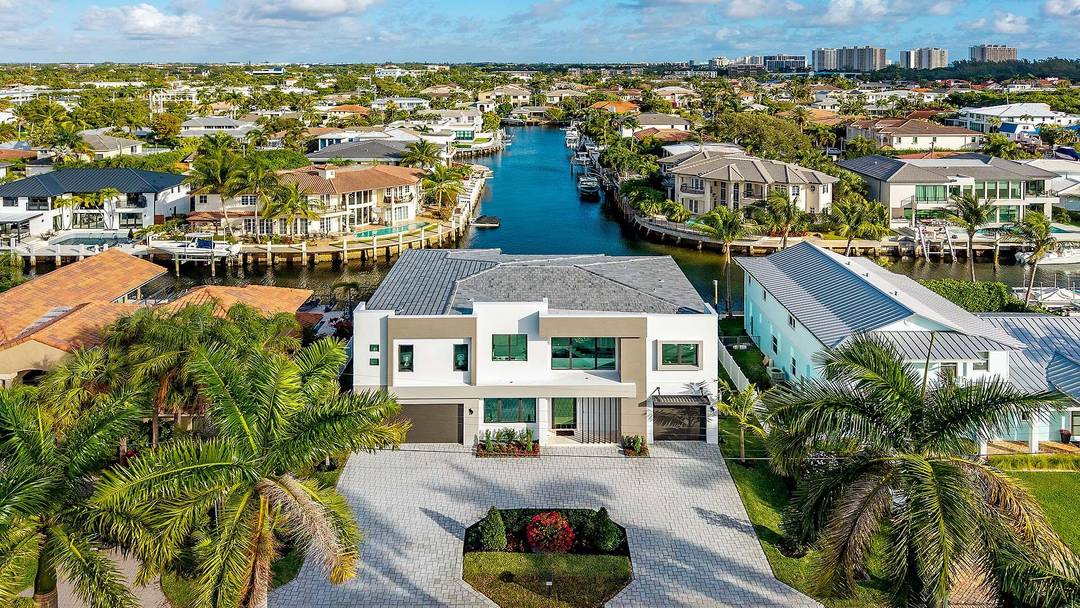 Crafted by Charles Thomas Builders, this brand new waterfront residence is a rare offering in Blue Inlet, one of East Boca Raton's most coveted enclaves.