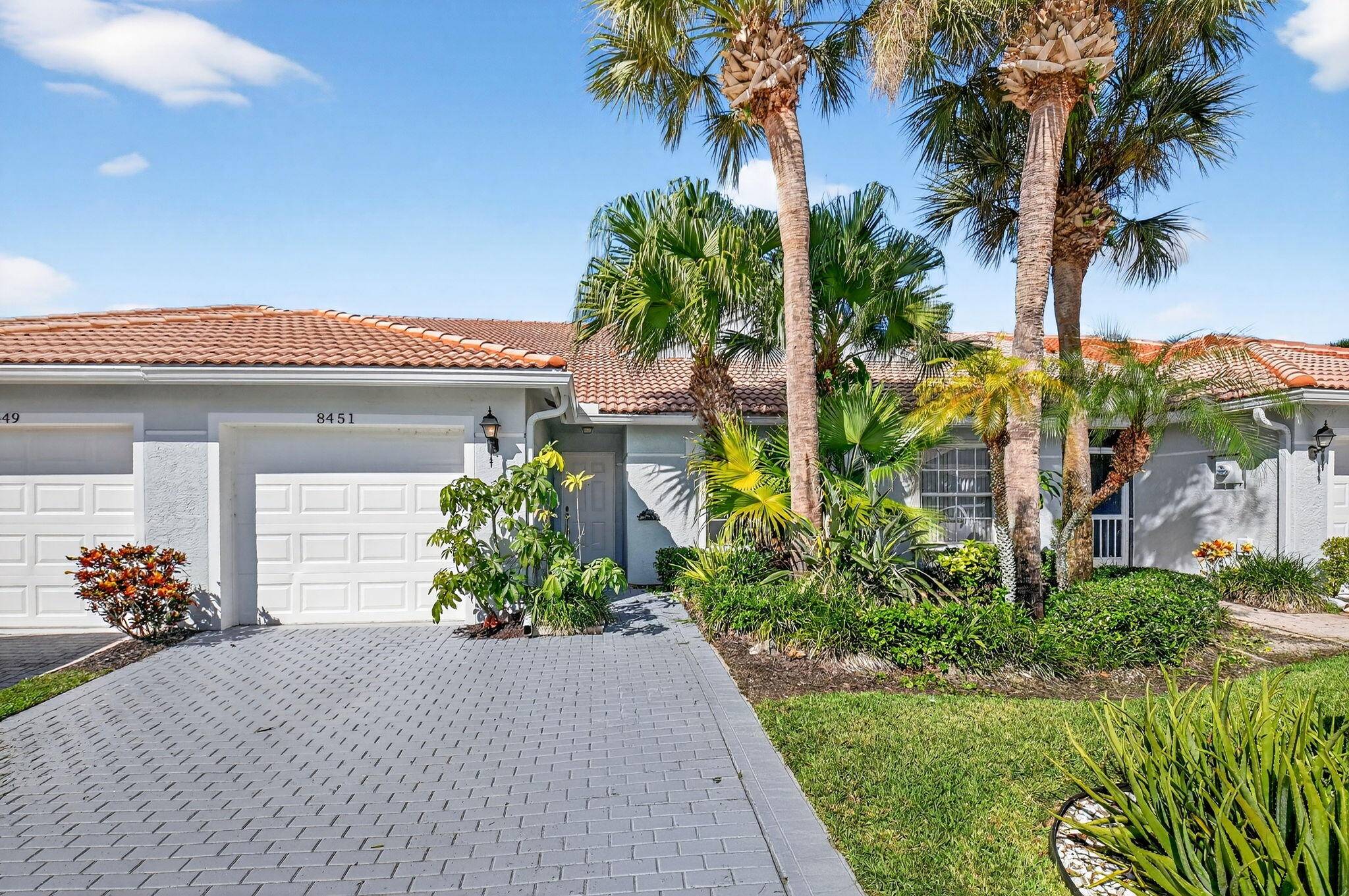 Experience luxury Florida retirement living in this stunning lakefront villa located in the premier 55 active adult community of Venetian Isles in Boynton Beach !
