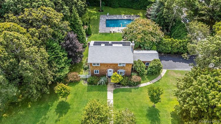 OFFERED AS SEASONAL RENTAL NOT YEAR ROUND Welcome 19 Pine Tree Lane, East Quogue, your quintessential Hamptons getaway in the heart of Tiana Shores.