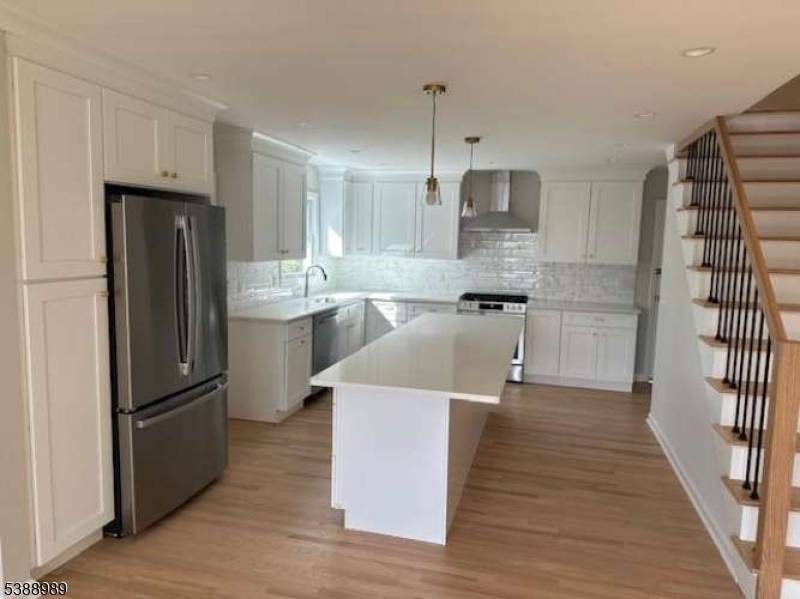 Welcome to this stunning four bedroom, two bath home, thoughtfully renovated from top to bottom with todays modern lifestyle in mind.