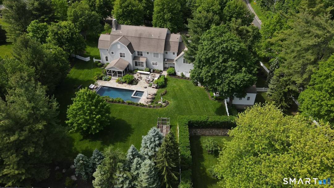 Experience the perfect harmony of sophisticated architecture and bucolic charm in this Colonial on a quiet cul de sac, centrally located in the Staples neighborhood.