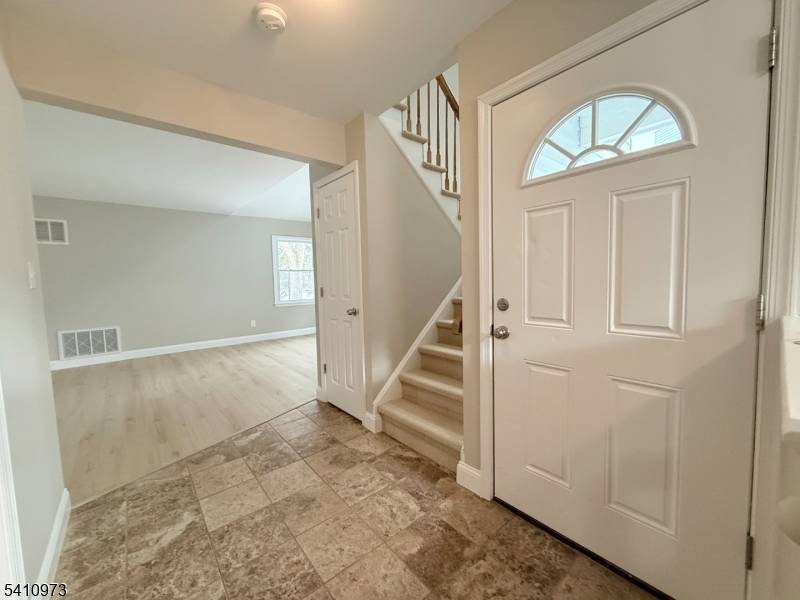 Welcome to 6 Twain Court, a beautifully updated townhome tucked away on a quiet cul de sac in the desirable Poets Corner community of Freehold.