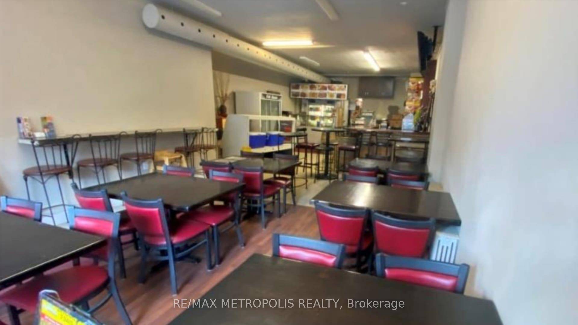 Fully equipment kitchen includes long commercial hoods, walk in cooler and walk in freezer.
