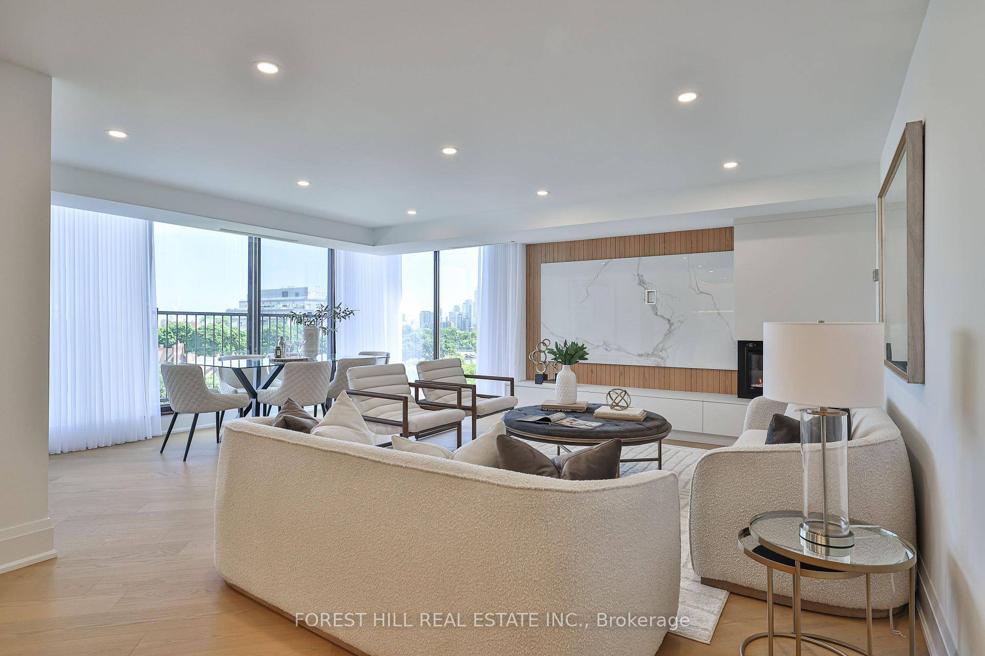 Welcome to an extraordinary corner suite in a boutique building nestled within coveted Forest Hill Village.