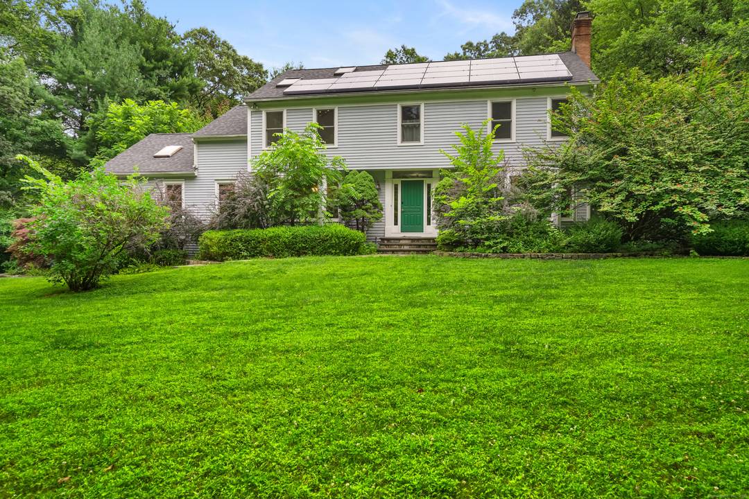 Spacious Colonial home centered on a beautiful property lined by stonewalls and mature plantings, with 4 bedrooms and 3 1 2 baths, is located in a desirable neighborhood on the ...