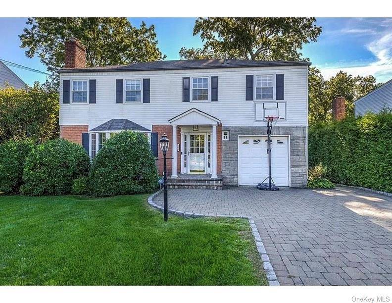 This sun filled home offers gleaming hardwood floors, a spacious and functional layout, and numerous recent updates.