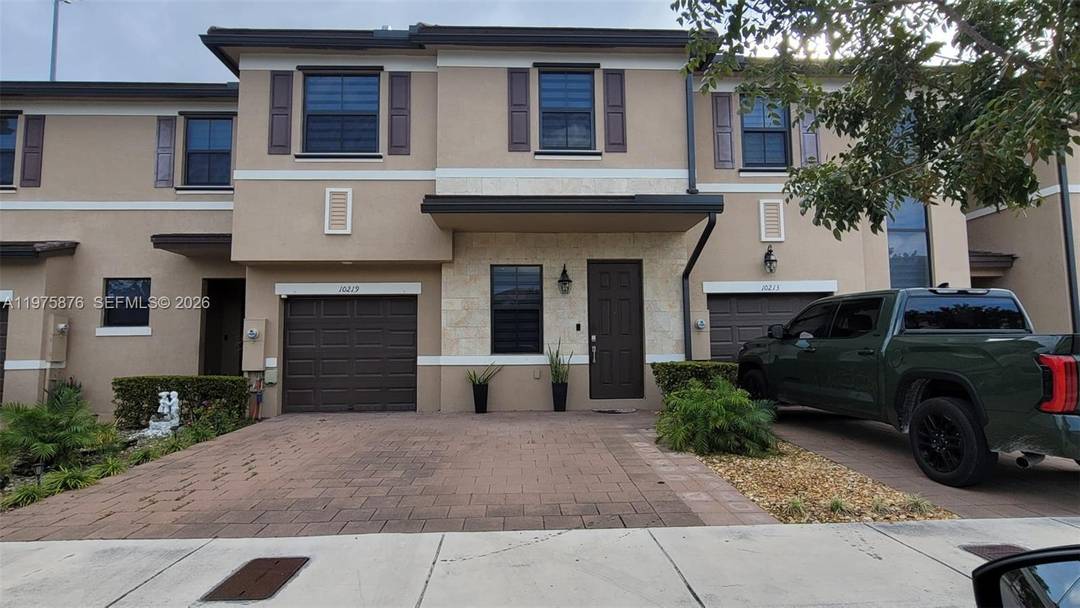 Beautifully maintained two story home located in a desirable gated community in Hialeah.