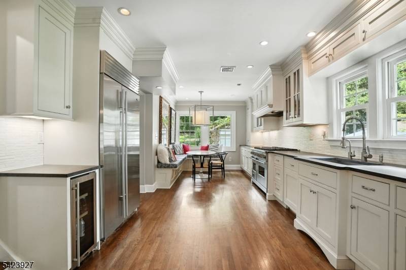 Set on a picturesque tree lined street with sidewalks in Madison's coveted Hill Section, this exceptional 4 bedroom, 3.