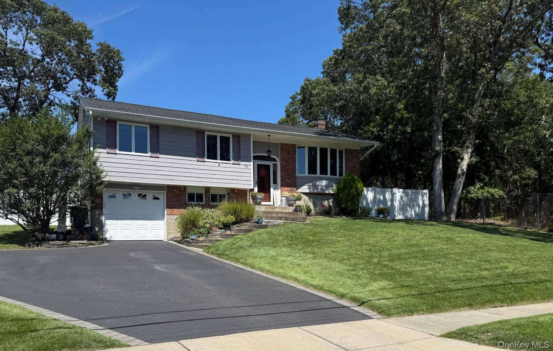 Welcome to this beautifully updated Raised Ranch, set on a shy half acre cul de sac lot and backing to the tranquil Caleb Smith nature preserve.