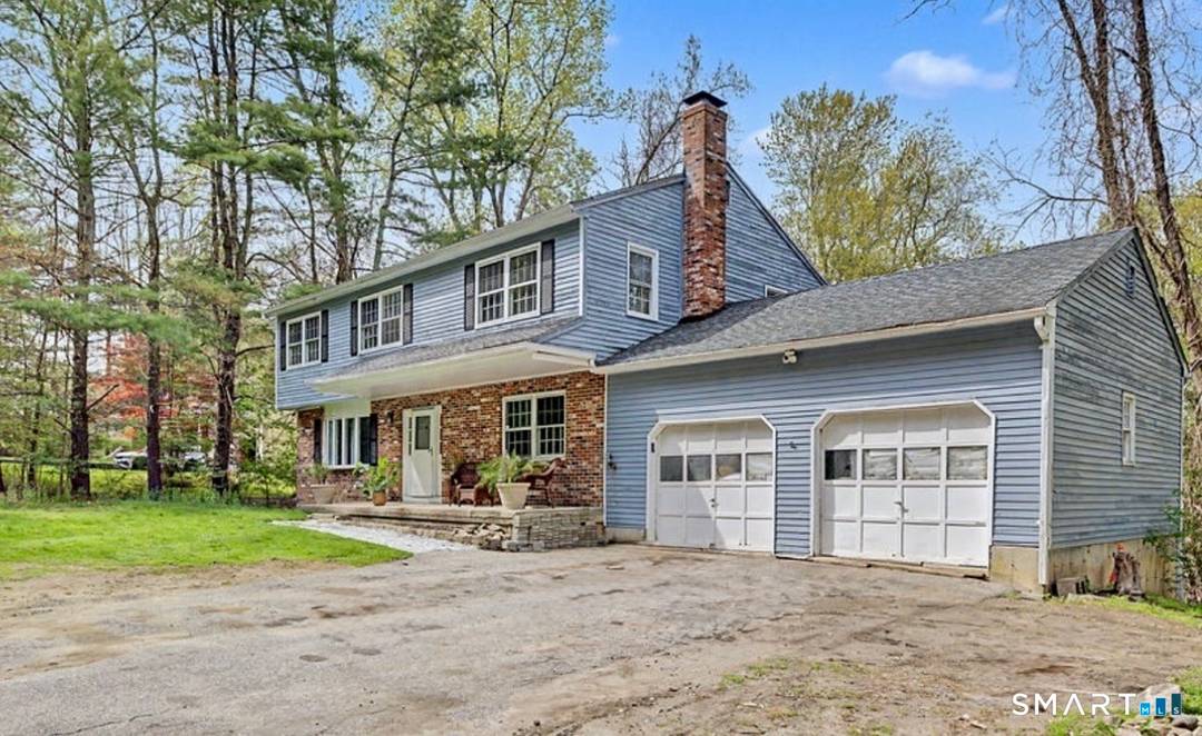 Rare opportunity to own a spacious colonial on nearly 2 private acres in Bethel.