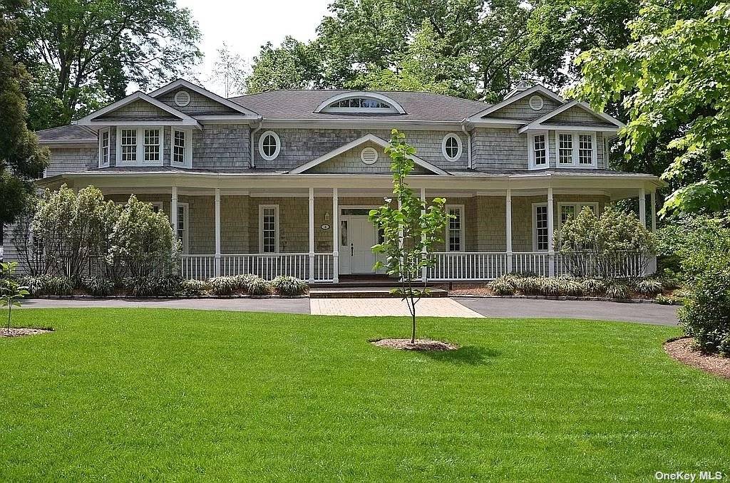 Exquisite center hall colonial featuring 5 BR's amp ; 5.