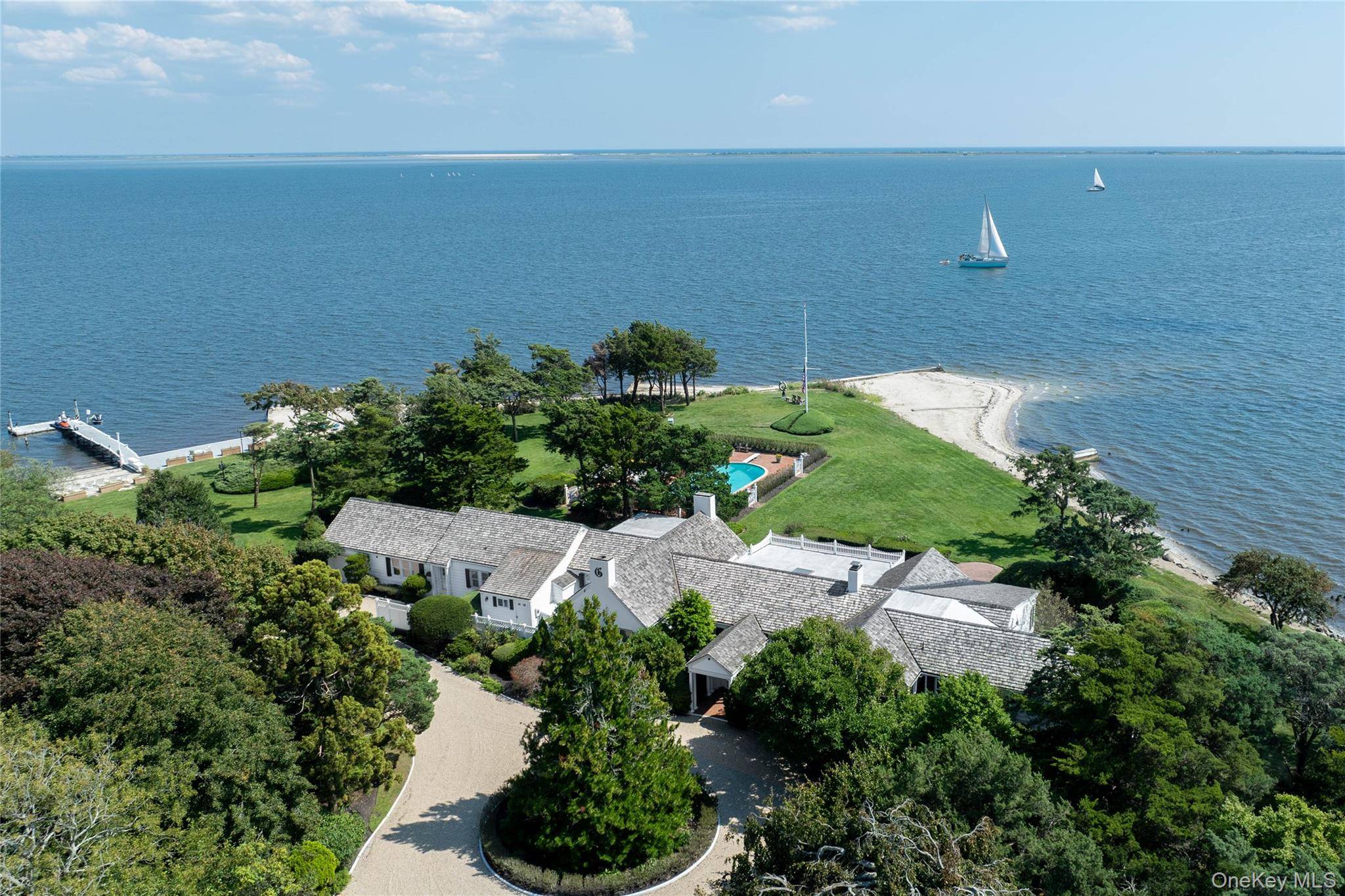 The Point Bellport Village The Point Bellport Village A rare waterfront estate where privacy, history, and refined luxury converge.