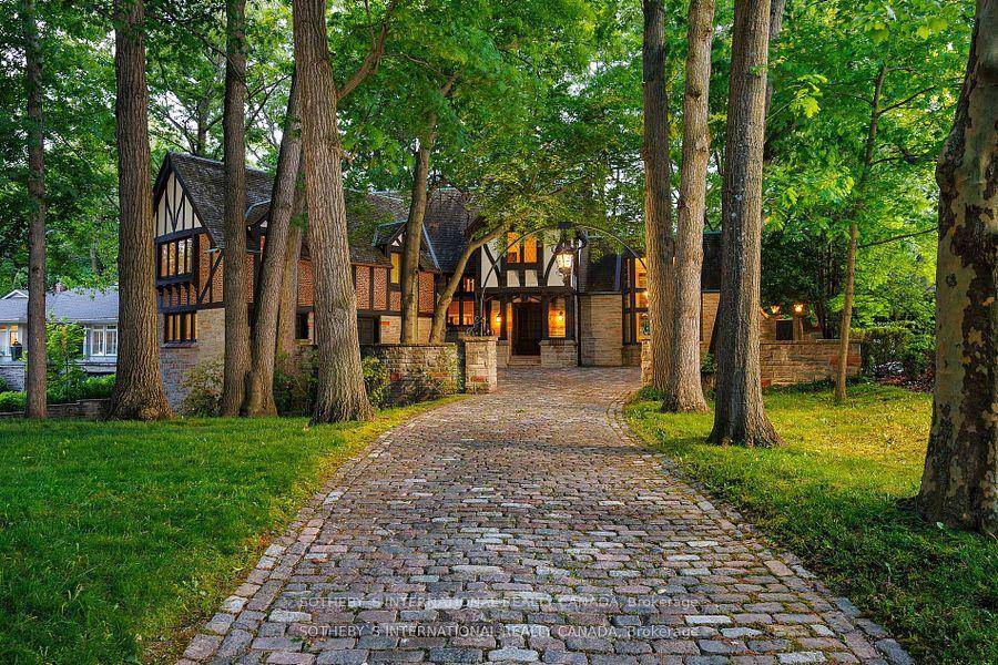 Step into elegance and history with this majestic Tudor estate, a unique gem backing onto St.