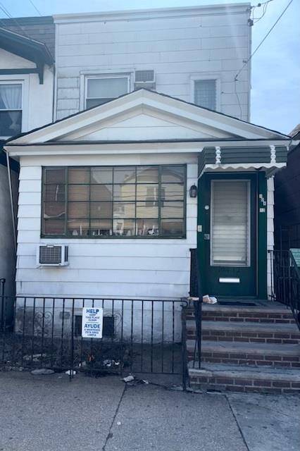 Welcome to this well maintained semi attached brick home nestled in the heart of vibrant Flushing.