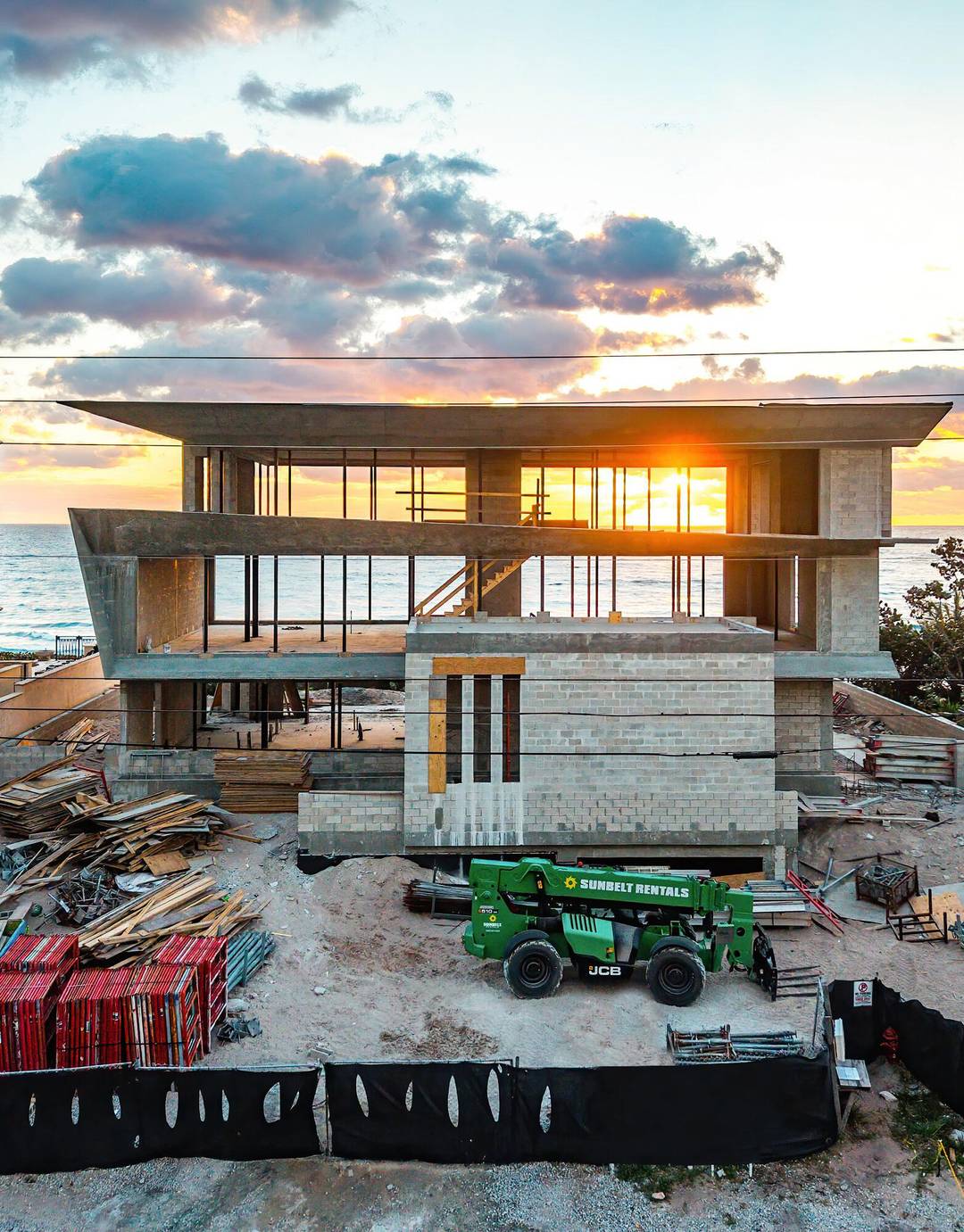 Experience unparalleled opulence in this new construction, oceanfront residence expertly crafted by Yodezeen Architectural and Design Studio in collaboration with J.