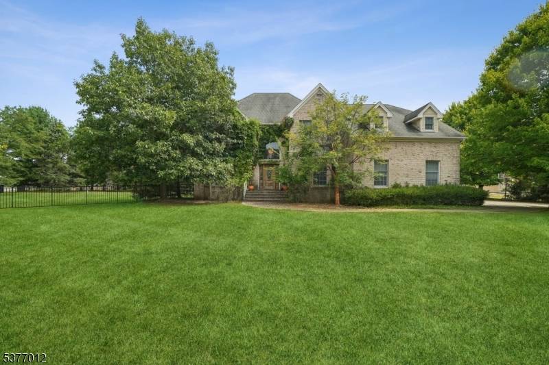 Nestled on a premier corner lot within a serene cul de sac, this commanding Colonial offers nearly 4, 000 sq ft of living space on a lush 1 acre parcel.