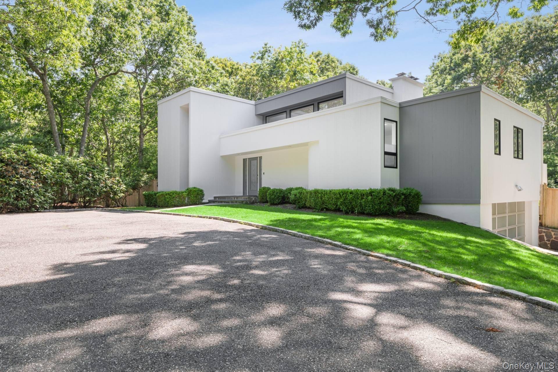 This pristine contemporary gated home, designed by Myron Shulman, is one of a kind.