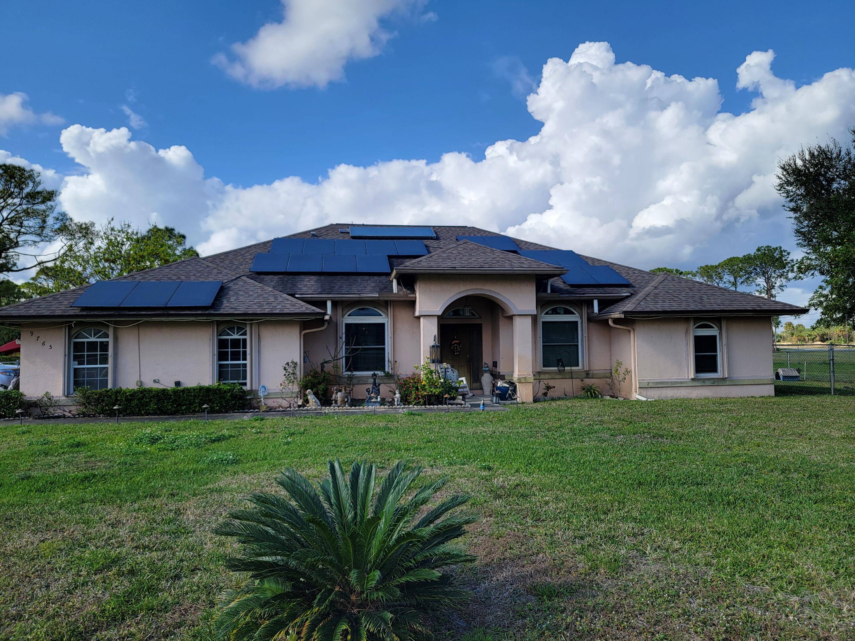 This exceptional property in The Acreage perfectly combines privacy, space, and country living while keeping you close to essential amenities and major highways.