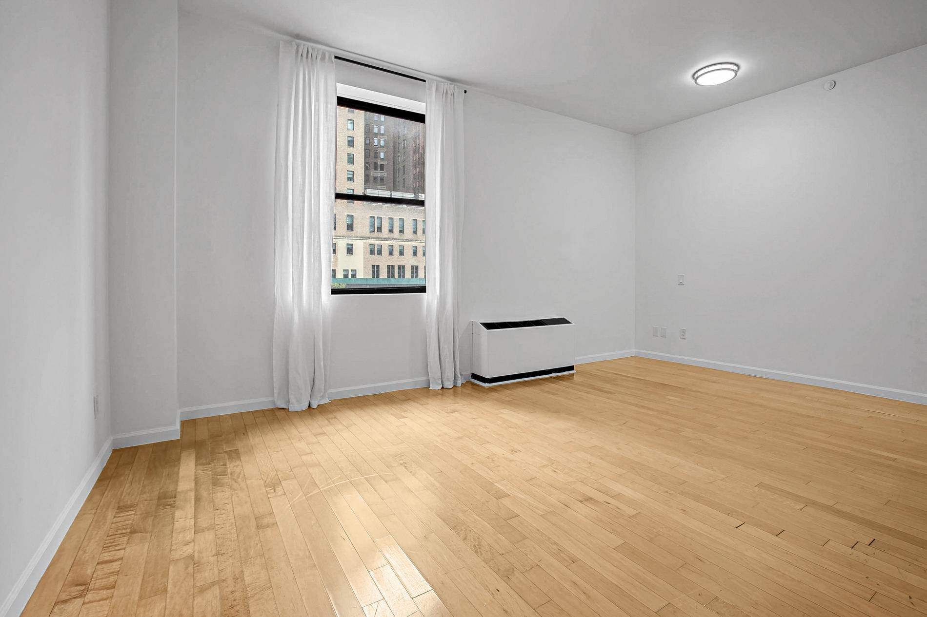 Amazing Loft 1 bedroom home in luxury doorman building at one of the lowest price per square foot in FiDi !