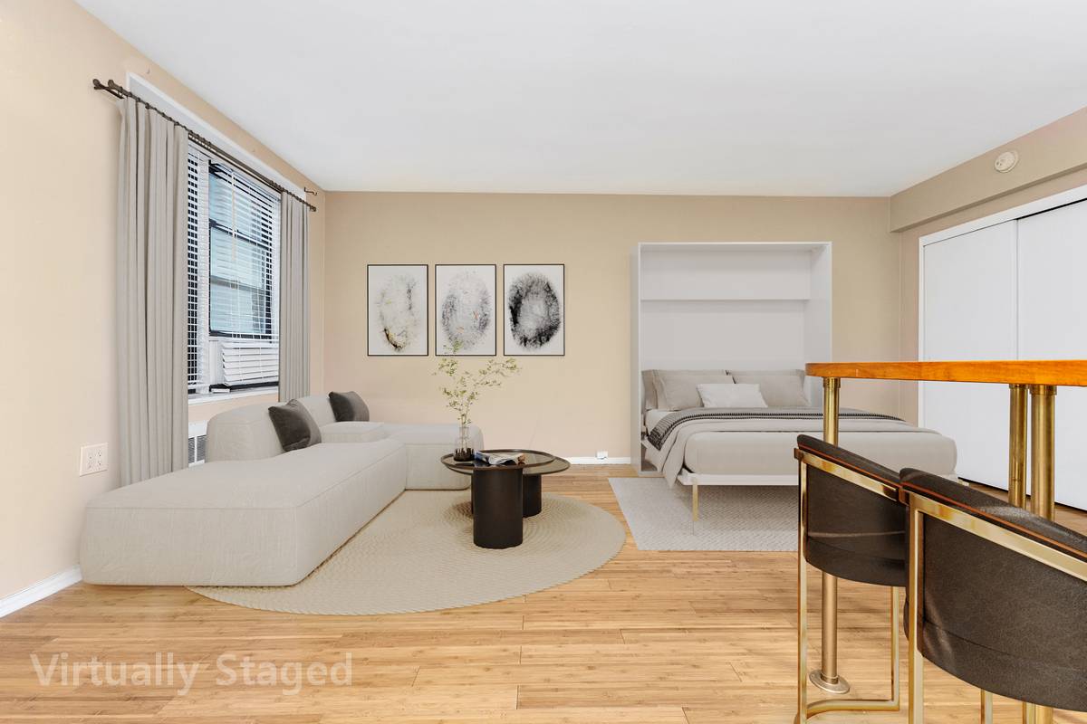 Charming studio with renovated open kitchen with stainless steel appliances, custom cabinets, and beautiful breakfast bar.