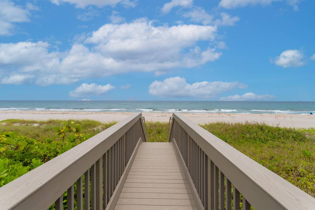 This contemporary, 3 story townhome with elevator, built only a few years back in East Boca Raton, half a block from the ocean, is bound to captivate your attention !