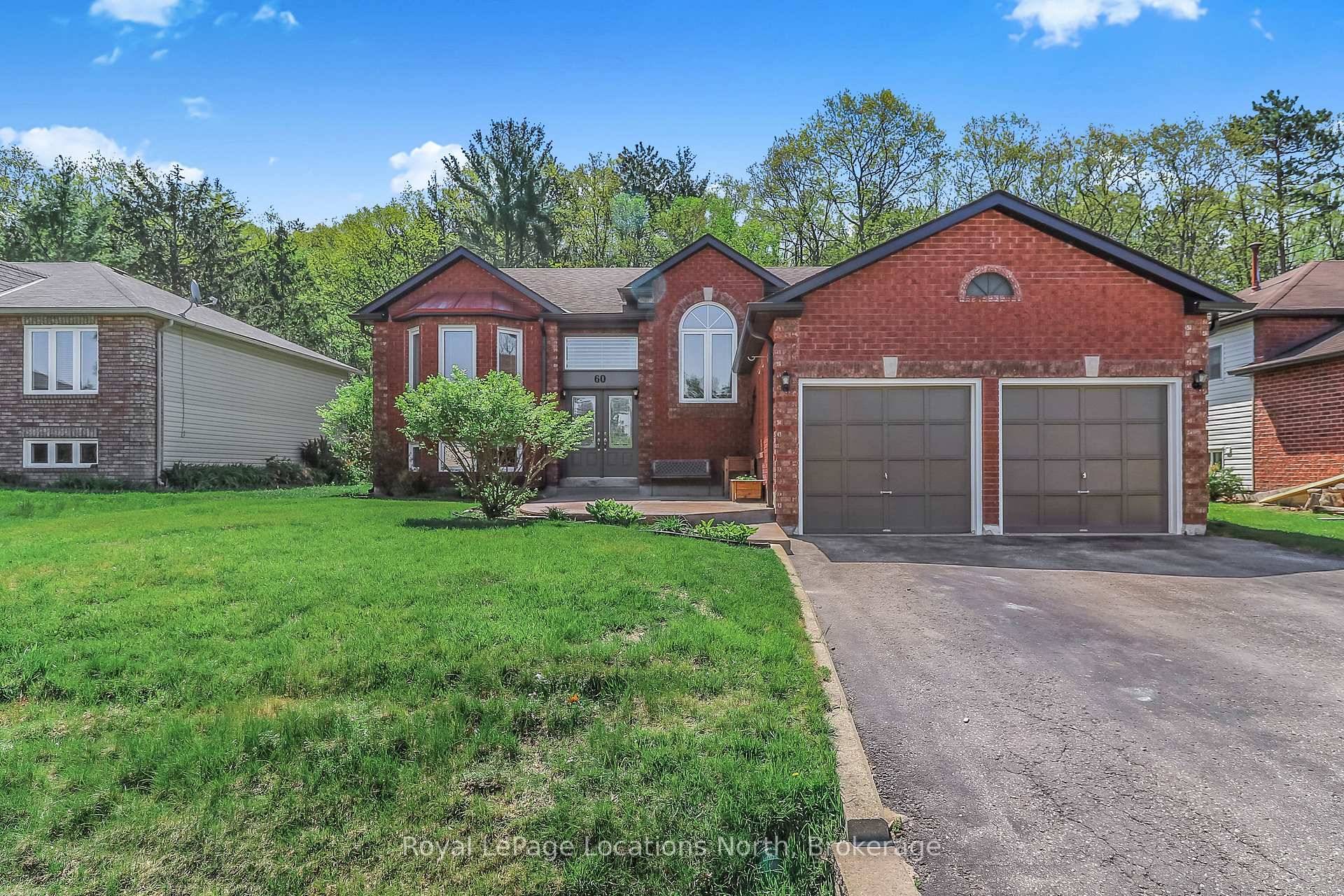 BACKING ON TO DESIGNATED GREENSPACE Fantastic location with nothing but mature trees and forest behind this well maintained 4 bedroom, 2 bathroom raised bungalow.