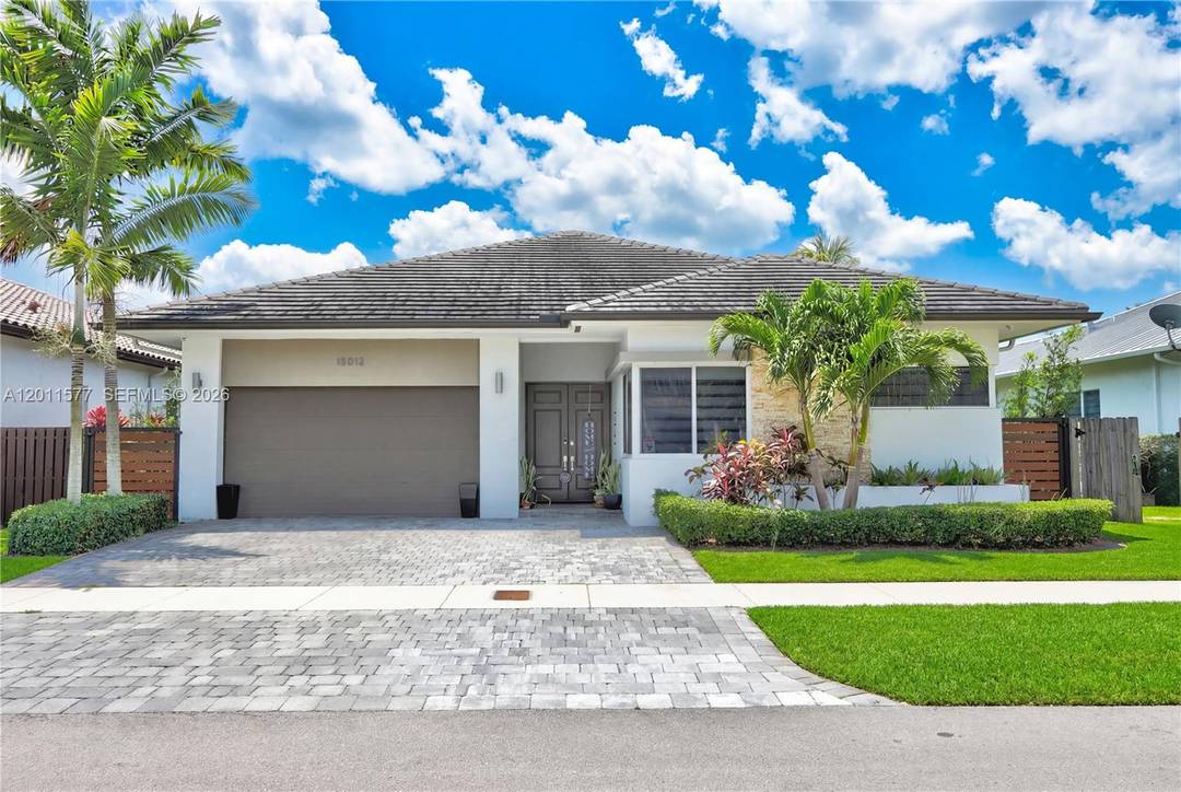 Experience modern elegance in this stunning Island Colonial residence located in the prestigious community of Venetian Parc.