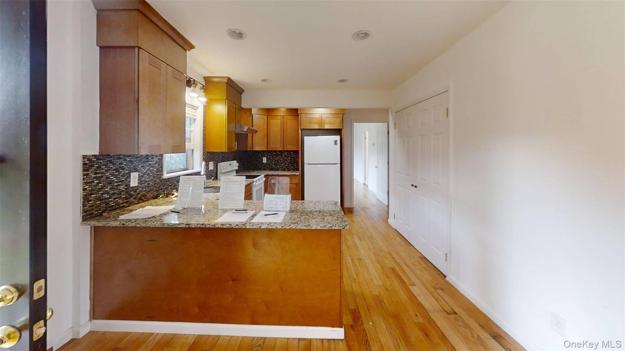 This Raised range was totally renovated in 2019 with all new appliances, boiler, bathrooms, Northwest Red oak floors, solid cement staircase, fresh landscaping.