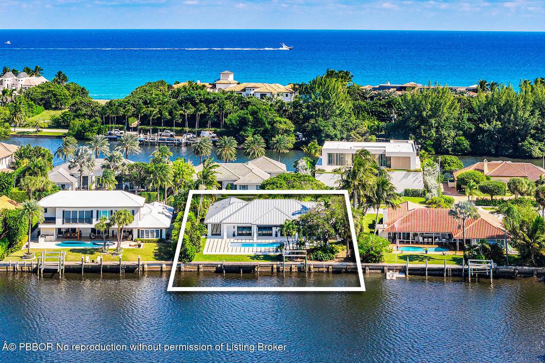 Just completed and rarely available is this exquisitely rebuilt waterfront residence in the coveted, guard gated community of Point Manalapan.