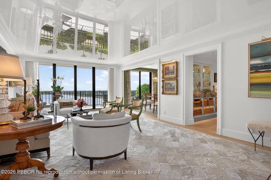 Elegant 11th floor three bedroom residence with sweeping East, South, and West exposures, offering breathtaking sunrise and sunset views.