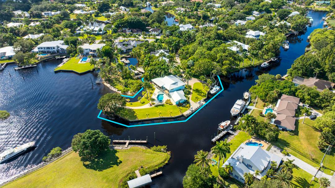 Rare opportunity to own a private peninsula estate with over 700' of shoreline on nearly 1 acre a boater's sanctuary with deep water, no fixed bridges to the ocean, and ...