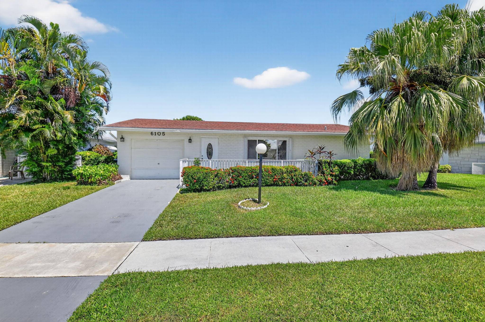 Beautifully updated lakefront single family home in the desirable 55 Delray Villas community !