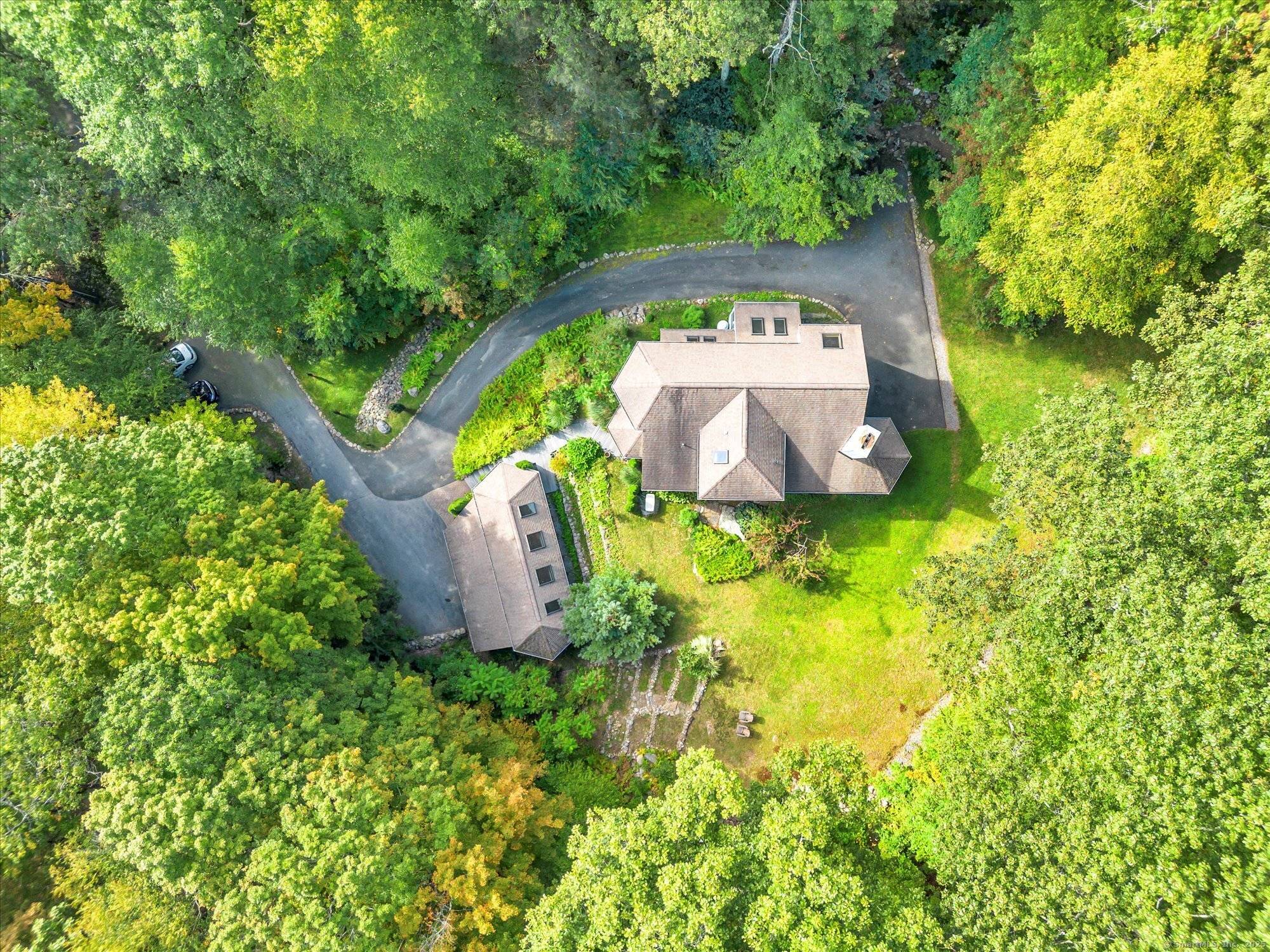 Set on 1. 58 private acres, this exceptional custom built home offers the ultimate escape into nature, where architectural beauty meets timeless craftsmanship.
