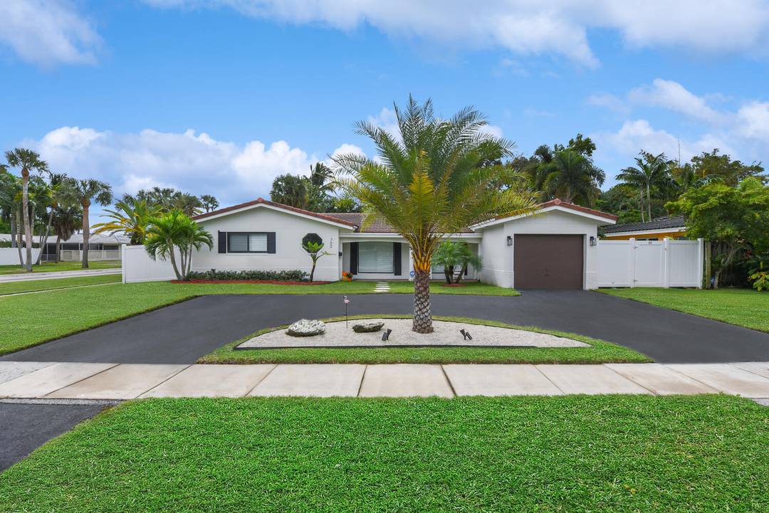 Renovated East Boca pool home on a fenced corner lot w sidewalks in highly desirable Royal Oak Hills AND Addison Mizner Elementary school district.