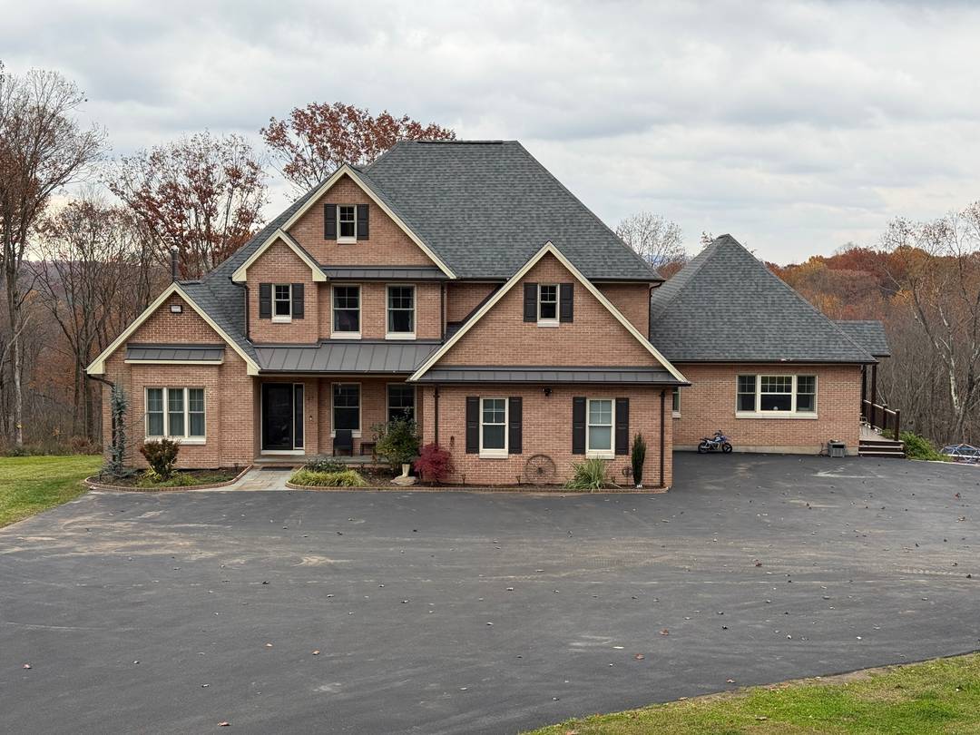 Welcome to this stunning contemporary brick residence built in 2022, offering 3, 764 square feet of elegant living space on a private 7.