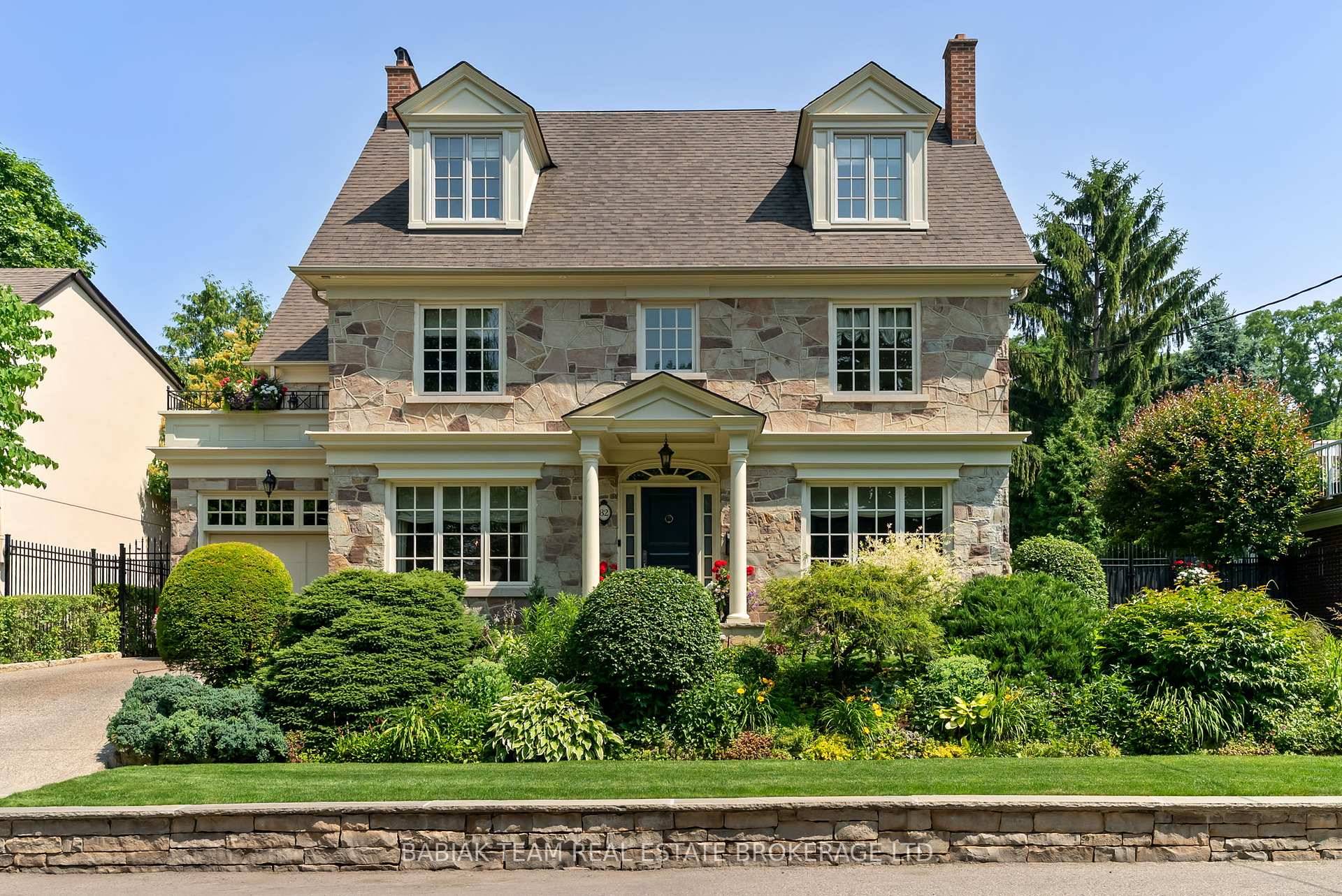 A glorious three storey Georgian centre hall residence in prestigious Old Mill, featuring four spacious bedrooms, five luxurious baths, and an air of timeless elegance paired with superior craftsmanship.