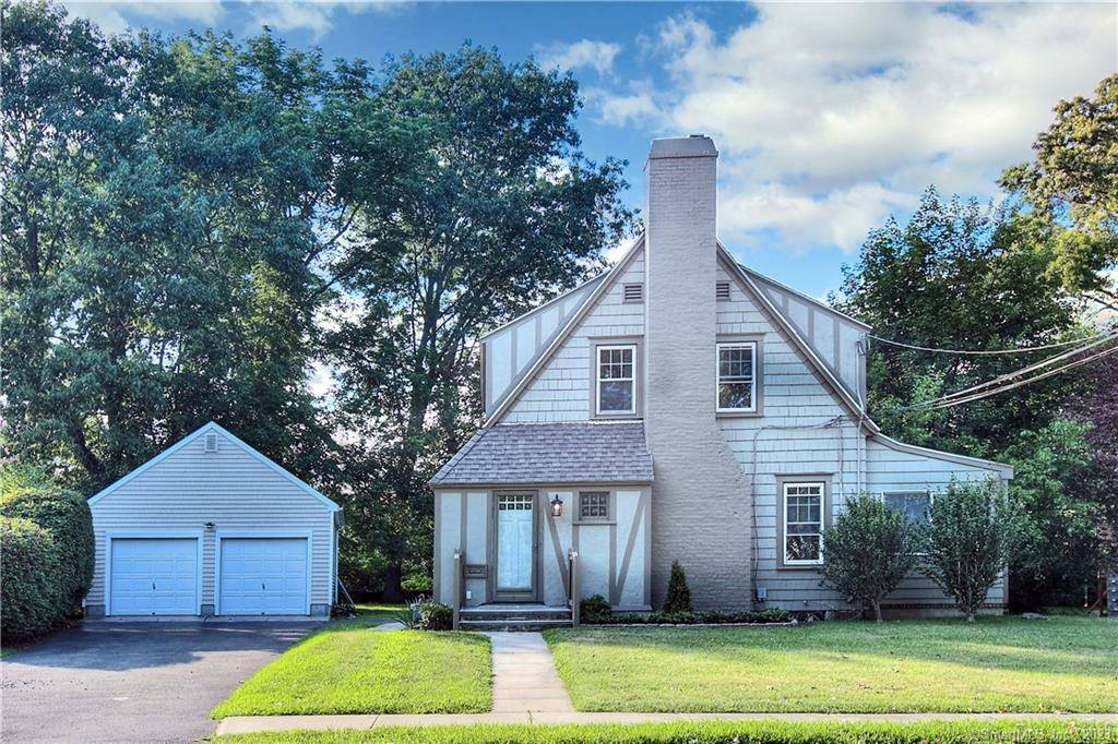 Storybook 1920's Tudor Colonial lovingly modernized while preserving its timeless character.