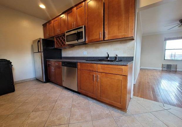 This adorable home features stunning views of the city skyline and hells gate bridge.