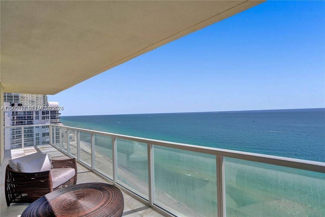 Unparalleled corner unit oceanfront living, unobstructed vistas of the sea from each window of this exquisite 27th floor domicile.