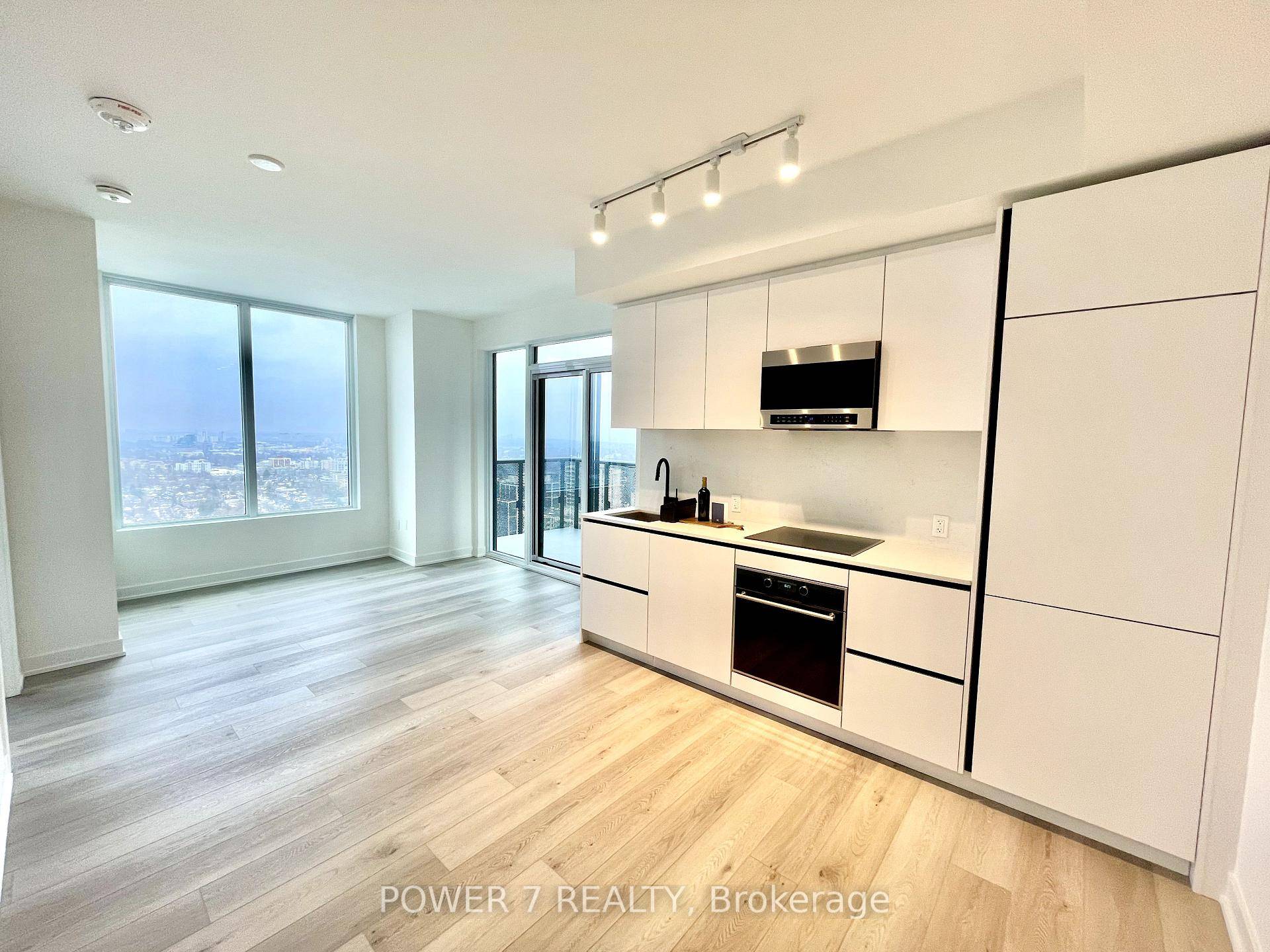 This bright and spacious corner suite features an open concept layout, smooth 9 ceilings, wide plank laminate flooring, and a large walkout balcony perfect for enjoying city views.