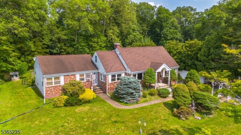 Charming Expanded Cape Cod with Mother Daughter Setup Prime Location !
