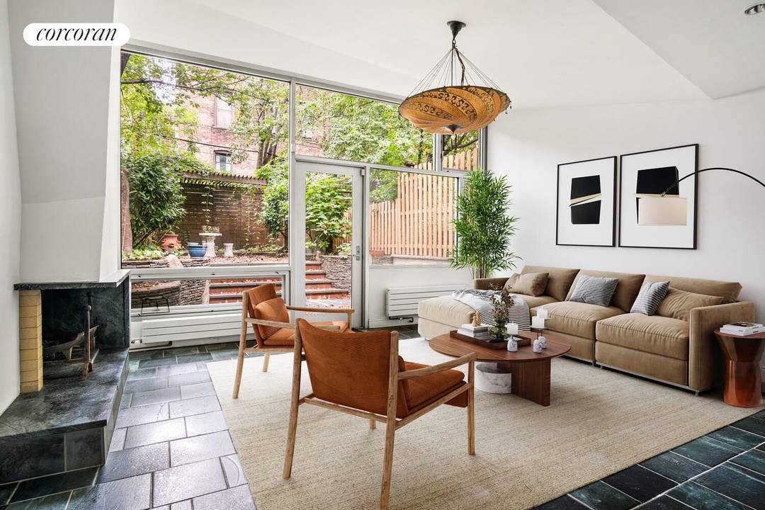 Welcome to 285 13th Street, a beautifully preserved four bedroom, three bath townhouse offering historic character, modern upgrades, and a lush private garden.
