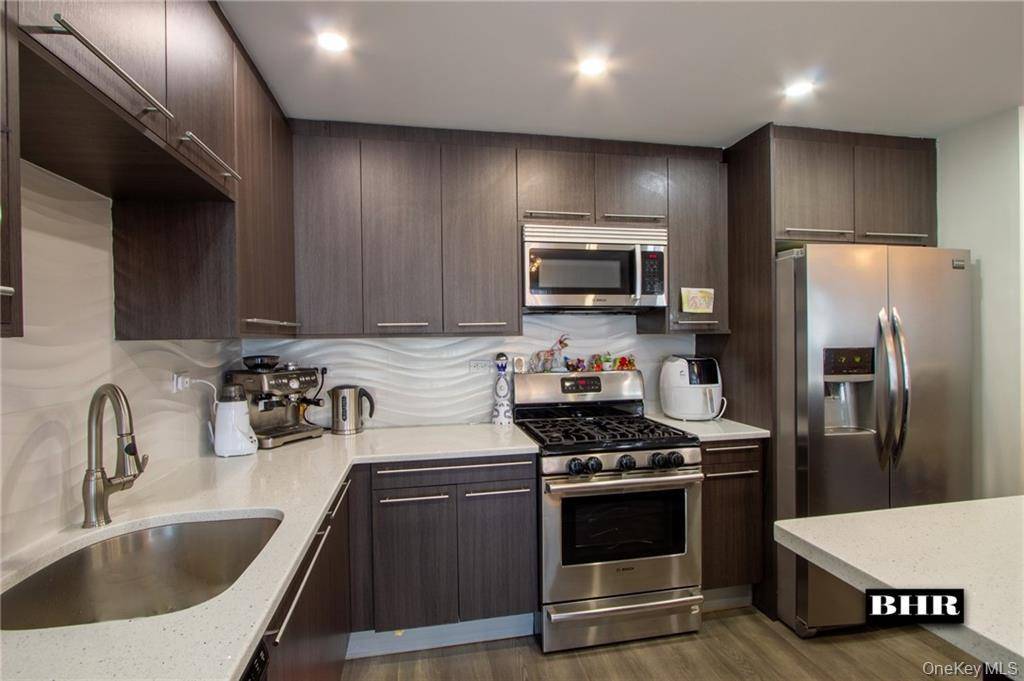 Renovated Large 3 bedroom 2 bathroom condominium with deeded parking and two terraces.