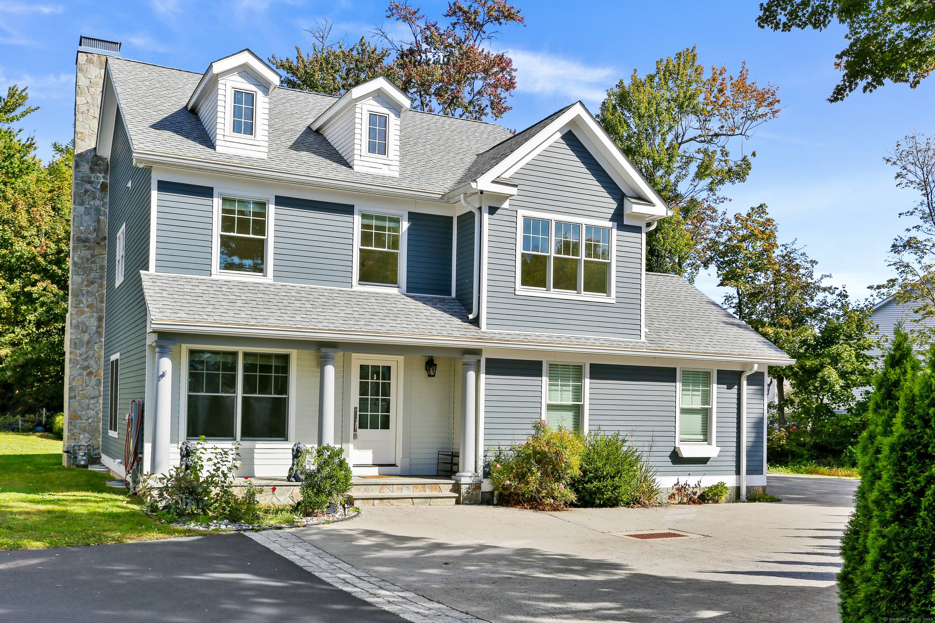 Experience refined living in this exceptional four bedroom Colonial, privately set in the desirable Black Rock neighborhood.