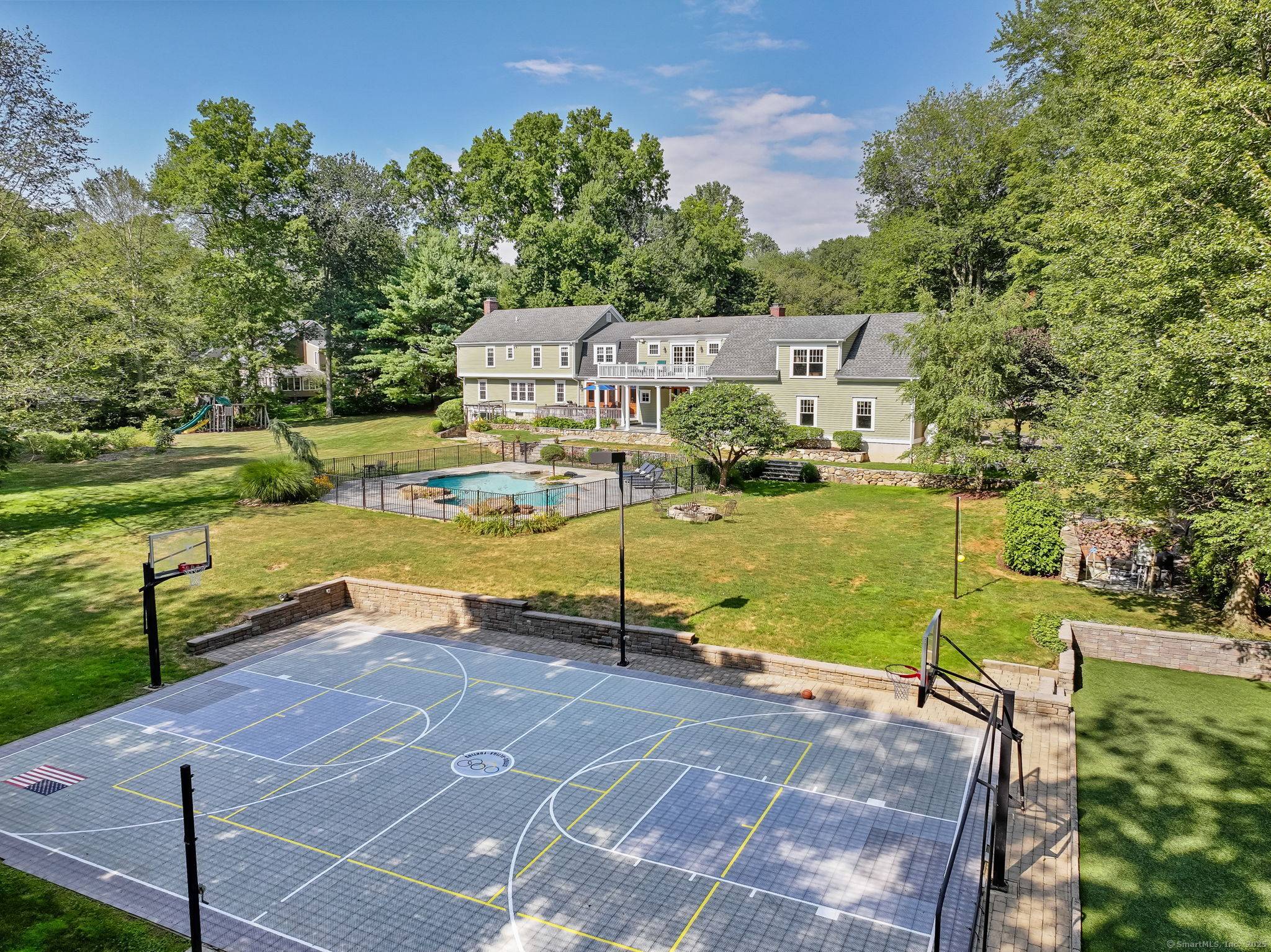 Welcome to 545 Shrub Oak Lane, an expanded Colonial on 2 private acres in Greenfield Hill.