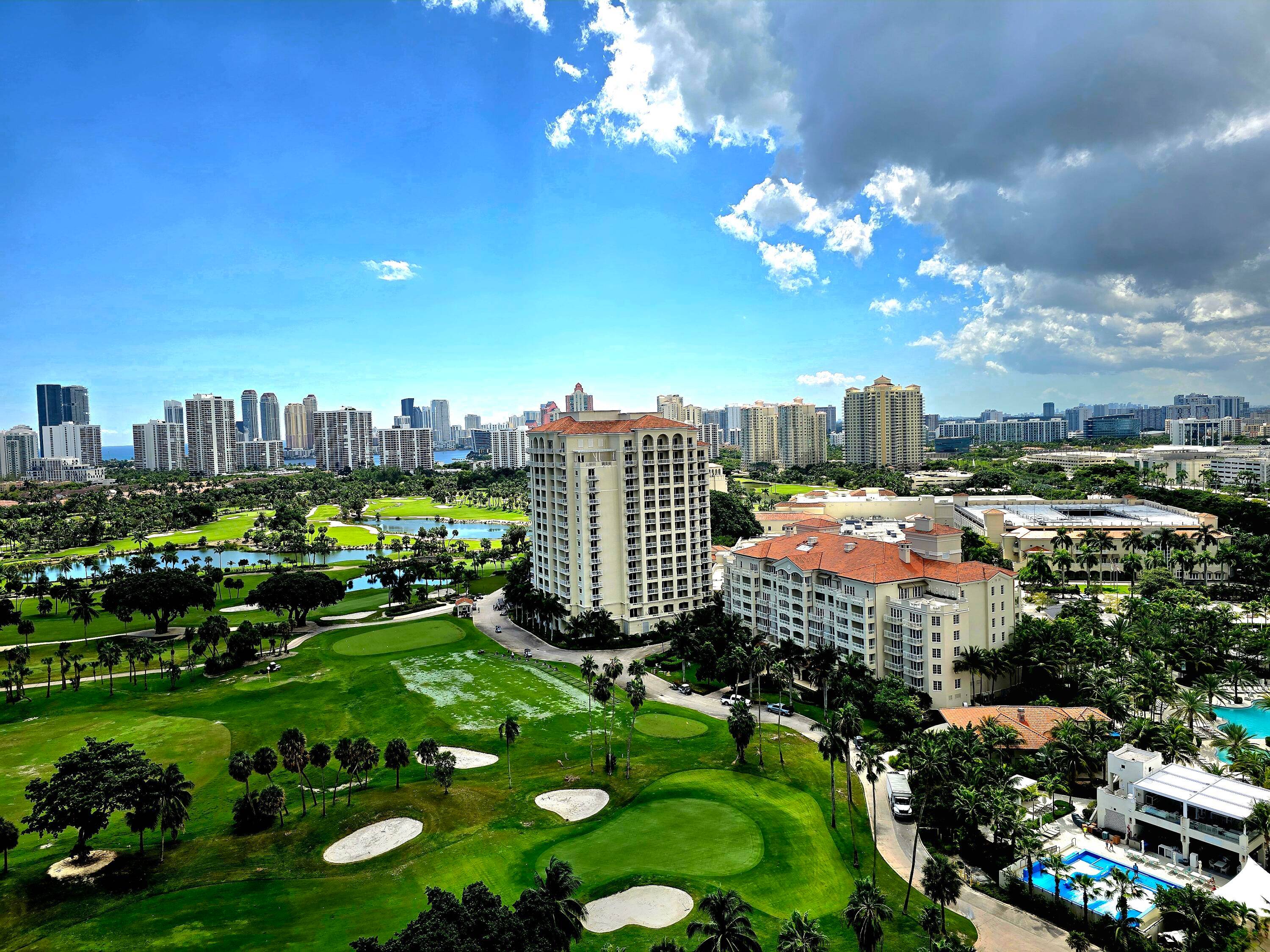 BREATHTAKING VIEW OF THE PRESTIGIOUS TURNBERRY GOLF COURSE AND LAKES ALONG WITH A GLIMPSE OF THE OCEAN FROM YOUR BALCONY.