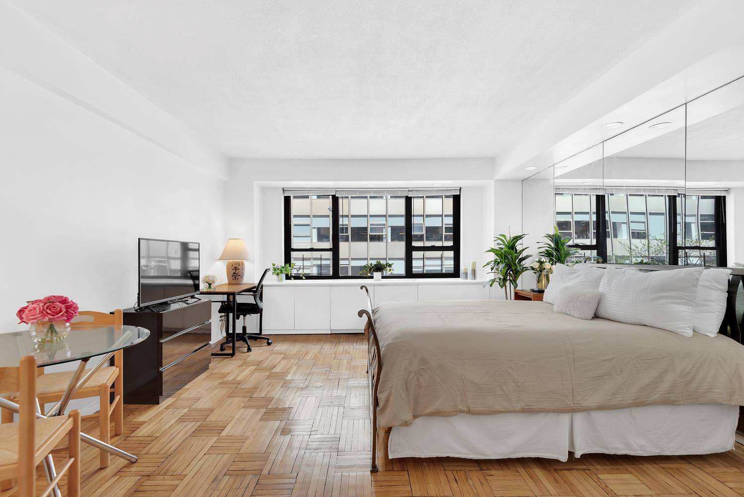 Beautiful, bright and airy, cozy, spacious, studio featuring wall of windows, hardwood floors, separate galley kitchen with granite floors, dishwasher, and abundant cabinet space.